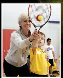  ??  ?? Time for change: Murray’s foundation lets kids sample tennis (left) as they aim to follow in the footsteps of her sons Andy and Jamie