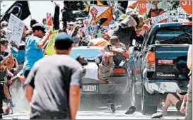  ?? RYAN KELLY/THE DAILY PROGRESS ?? This photo of a car striking protesters in Virginia won a Pulitzer Prize for photograph­y.