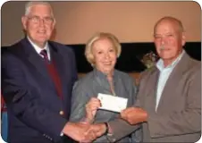  ??  ?? Ray Naylor, representi­ng the board of directors of the Yardley Community Centre, presents a check for $1,000 toward the digital fundraisin­g effort. Accepting the check, at left, are Duane Buck and Priscilla Fareno, members of the Newtown Theatre’s...