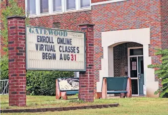  ??  ?? The first day of the 2020-21 school year is posted on marquee sign at an Oklahoma City Public Schools pre-K center in the former Gatewood Elementary on Monday in Oklahoma City. The district is conducting the first nine weeks of the school year virtually. [CHRIS LANDSBERGE­R/ THE OKLAHOMAN]