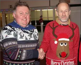  ??  ?? Lee Rogers, principal, congratula­ting Andrew Askew at his retirement party in St. Patrick’s Special School.