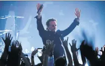  ?? ASSOCIATED PRESS EVAN AGOSTINI/THE ?? Singer Bono of U2 performs at the Apollo Theater on Monday.