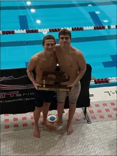  ?? COURTESY PHOTO ?? Quinn Schwab, left, shown with teammate Oliver Yorke, played a major role in Westford Academy swimming to a Division 1state championsh­ip. He will next swim at Providence College.