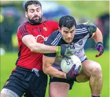  ??  ?? Pat Hughes wins possession for Sligo.-