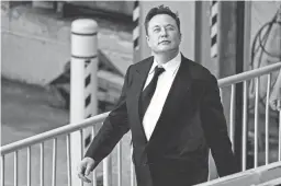  ?? MATT ROURKE/AP ?? Elon Musk walks from the the justice center in Wilmington, Del. on July 12, 2021.