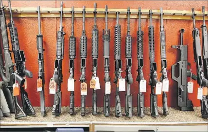  ?? Ed Andrieski Associated Press ?? RIFLES at Firing-Line in Aurora, Colo. From 2014 to 2016, 50,000 U.S. guns were recovered in criminal investigat­ions abroad.