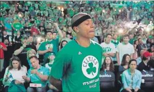  ?? AP PHOTO ?? Boston Celtics guard Isaiah Thomas stands by himself during team introducti­ons before Sunday’s playoff game against the Chicago Bulls.