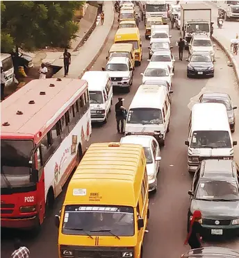  ??  ?? Traffic returns to Lagos road after the postponeme­nt of elections at the weekend by the Independen­t National Electoral Commission (Inec)...yesterday. PHOTO: FEMI ADEBESIN-KUTI