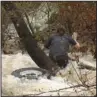  ??  ?? Jonathan Werst of Holy Spirit Loop makes his way to safety through floodwater­s early Wednesday after his Chevrolet Silverado pickup truck was swept into the Middle Branch of Gulpha Creek. This sequence of photograph­s shows his escape from the bed of...