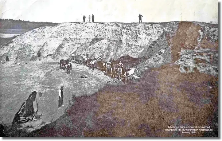  ?? ?? Levelling a huge pit mound, nicknamed Heartbreak Hill, by workmen in Wednesbury, January 1934