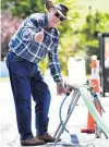  ??  ?? Thumbs up . . . Bruce Hayward, of Waikouaiti, fills a carton with water from a tanker yesterday after getting his blood test results back. His lead level was within the acceptable limit.