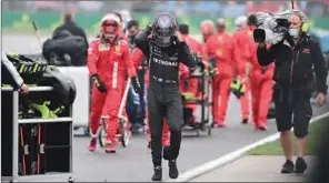  ?? (AFP) ?? Mercedes’ British driver Lewis Hamilton leaves after the F1 GP of Turkey in Istanbul on Sunday.