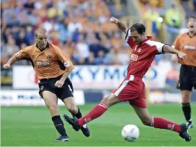  ?? ?? Alex Rae slips the ball past Walsall’s Pedro Matia (PA Photo/nick Potts)