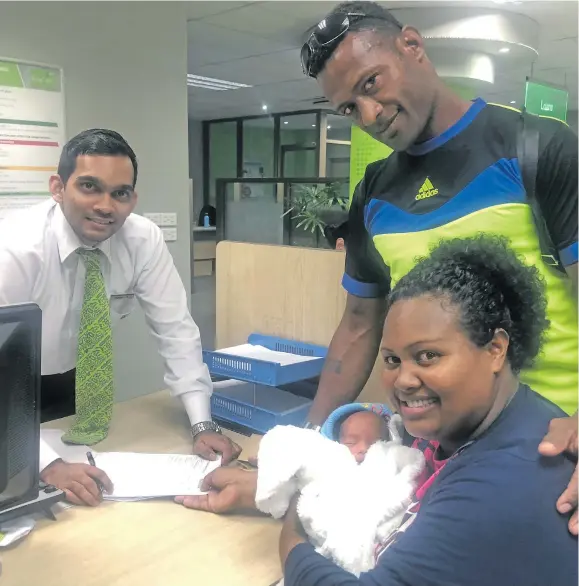  ?? Photo: Selita Bolanavanu­a ?? Verenaisi Donu, husband Salamisa and their baby boy Kini Viliame Pai, with BSP officer Tanweer Zoheb Ali at the BSP branch at Thomson Street, Suva, on August 16, 2018.