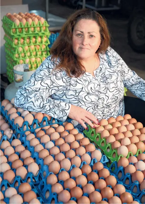  ?? Picture: ALISON WYND ?? DIME A DOZEN: Julie Kos, from Kossies Free Range Eggs, says the supermarke­t price war is hurting free-range egg producers.