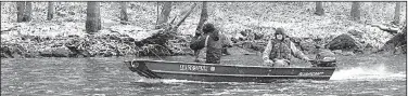  ?? Arkansas Democrat-Gazette/BRYAN HENDRICKS ?? Ed Kubler (front) and Bill Eldridge motor through the snow to Buffalo Shoal during a phenomenal day of fishing on the White River.