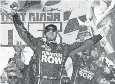  ?? MIKE DINOVO, USA TODAY SPORTS ?? Martin Truex Jr. celebrates Sunday after winning at Chicagolan­d Speedway to advance in the Chase for the Sprint Cup.