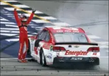  ?? PAUL SANCYA — THE ASSOCIATED PRESS ?? Kyle Larson celebrates after winning his fourth Cup race at Michigan Internatio­nal Speedway. straight