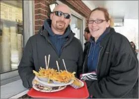  ?? FILE PHOTO ?? In this file photo, Dennis Recore Jr. and Julie Crossman of North Greenbush brave cold temperatur­es to enjoy a meal outside at Jack’s Drive In.