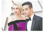  ??  ?? Lucy Boynton y Rami Malek al desfilar por la alfombra roja, ayer. Reuters