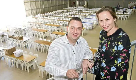  ?? Photo: Nev Madsen ?? GLITZ AND GLAMOUR: Preston Peak director and executive chef Rick Osborne and LifeFlight Foundation spokeswoma­n Suzie Byrnes preparing for the Behind the Hangar Doors Toowoomba LifeFlight Ball.