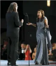  ?? DANNY MOLOSHOK — AP IMAGES ?? Glenn Weiss proposes to his girlfriend, Jan Svendsen, after accepting the award for outstandin­g directing for a variety special for “The Oscars” at the 70th Primetime Emmy Awards on Monday, Sept. 17, at the Microsoft Theater in Los Angeles.