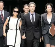  ?? John McCusker / The Advocate ?? Ex-BP engineer Kurt Mix leaves court on Friday with his wife, Xiaohong Guan.
