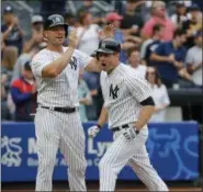  ??  ?? Chase Headley, right, celebrates with Matt Holliday after hitting a two-run home run during Yankees victory over Rays at Yankee Stadium.