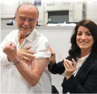  ??  ?? CARP president Moses Znaimer receiving the high-dose flu shot from CARP Health 360 nurse, Michelle Colenutt, at the 2017 Toronto ZoomerShow