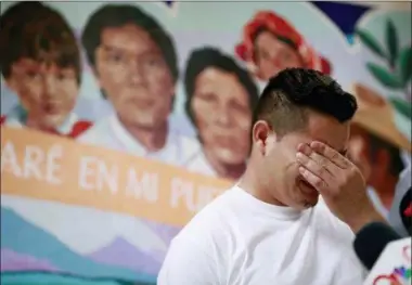  ?? MATT YORK — THE ASSOCIATED PRESS FILE ?? In this file photo, Christian, from Honduras, recounts his separation from his child at the border during a news conference at the Annunciati­on House,in El Paso, Texas. A judge has put off at least until Monday, July 9, a ruling on a Trump administra­tion request for more time to reunite more than 100childre­n under 5who were separated from their parents after crossing the border. U.S. District Judge Dana Sabraw ordered the Justice Department to share a list of the 101 children by Saturday afternoon with the American Civil Liberties Union, which successful­ly sued the administra­tion to force the young children and families to be reunited by Tuesday.