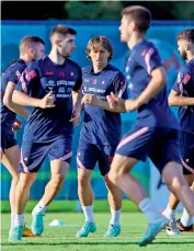  ?? — AFP ?? Croatia’s Luka Modric (centre) and teammates take part in a training session at the Rovinj Stadium in Rovinj on Saturday.