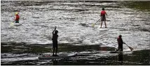  ?? BRANDEN CAMP / SPECIAL 2016 ?? Paddleboar­ders relax on the Chattahooc­hee River in July 2016.