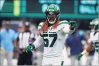  ?? Seth Wenig / Associated Press ?? Jets LB C.J. Mosley directs the defense during Sunday’s win over the Titans.