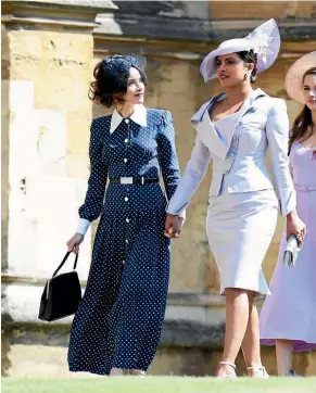  ?? GETTY IMAGES ?? Abigail Spencer, left, and Priyanka Chopra arrive at the wedding of Prince Harry and Meghan Markle.