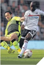  ??  ?? ■ Kermorgant tackles Aluko.