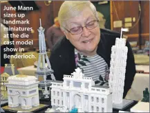  ??  ?? June Mann sizes up landmark miniatures at the die cast model show in Benderloch.