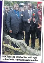  ??  ?? JOKER:The Crocodile, with red buttonhole, meets his namesake