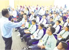  ??  ?? The pupils of SK Gentisan being briefed on UPSR preparatio­n.