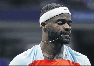  ?? MATT ROURKE/ASSOCIATED PRESS ?? Frances Tiafoe walks back to the baseline after losing a point to Carlos Alcaraz on Friday. Tiafoe went all out against Alcaraz, shouting, “Ï’m putting my heart on the (expletive) line!”