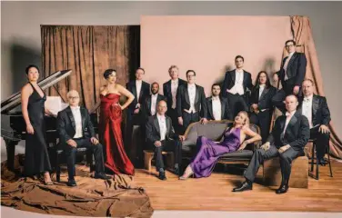  ?? Chris Hornbecker ?? Pink Martini featuring Thomas Lauderdale and singers China Forbes (red) and Storm Large.