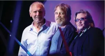  ?? JESSE GRANT/GETTY IMAGES FOR DISNEY ?? Actors Harrison Ford, Mark Hamill and Carrie Fisher attend a Star Wars fan concert by the San Diego Symphony.