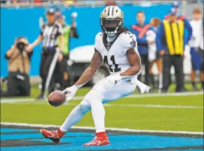  ?? Gerry Broome / Associated Press ?? New Orleans Saints running back Alvin Kamara scores a touchdown against the Carolina Panthers during the first half in December.