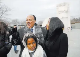  ?? Pablo Martinez Monsivais ?? The Associated Press Martin Luther King III, with his wife Arndrea Waters, and their daughter Yolanda, 9, visit the Martin Luther King Jr. Memorial on the National Mall on Monday.