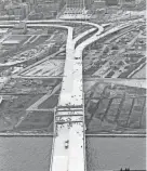  ?? JOURNAL SENTINEL FILES ?? The Daniel Hoan Bridge was approved in 1966. Work started in 1970 and was finished in 1972. But because of a controvers­y centering around freeway constructi­on, it wasn't opened until Nov. 5, 1977. During the time it sat idle it was called "the bridge to nowhere." This is an aerial photo of the dedication ceremonies.