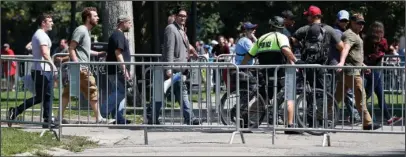  ?? The Associated Press ?? ‘FREE SPEECH’ RALLY: Organizers depart a “Free Speech” rally staged by conservati­ve activists on Boston Common on Saturday in Boston. One of the planned speakers of a conservati­ve activist rally that appeared to end shortly after it began says the...