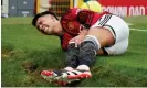  ?? Photograph: Dave Thompson/AP ?? Lisandro Martinez grimaces in pain after injuring his right knee during Manchester United win at home to West Ham.