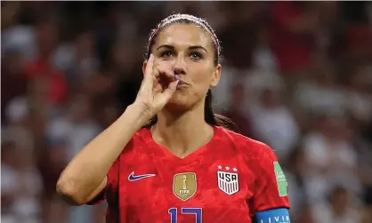  ?? Photograph: Catherine Ivill - FIFA/FIFA via Getty Images ?? Alex Morgan celebrates scoring against England in USA’s 2019 World Cup semi-final win by mimicking sipping a cup of tea.