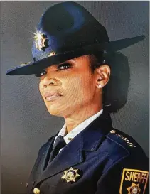  ?? CONTRIBUTE­D ?? DeKalb County Sheriff Melody Maddox is the first woman to be sworn into duty in the role. This compelling image of strength and certainty helped a young woman when she needed it.