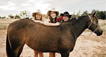  ??  ?? JCU vet students Ashley Heilbronn, Kelsey Tsang and Laura Adams posed in the buff for a fundraisin­g calendar.