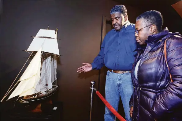  ?? Ned Gerard / Hearst Connecticu­t Media ?? Jeffrey Fletcher leads Carolyn Wright on a tour of the Ruby & Calvin Fletcher African American History Museum in Stratford on Feb. 15.